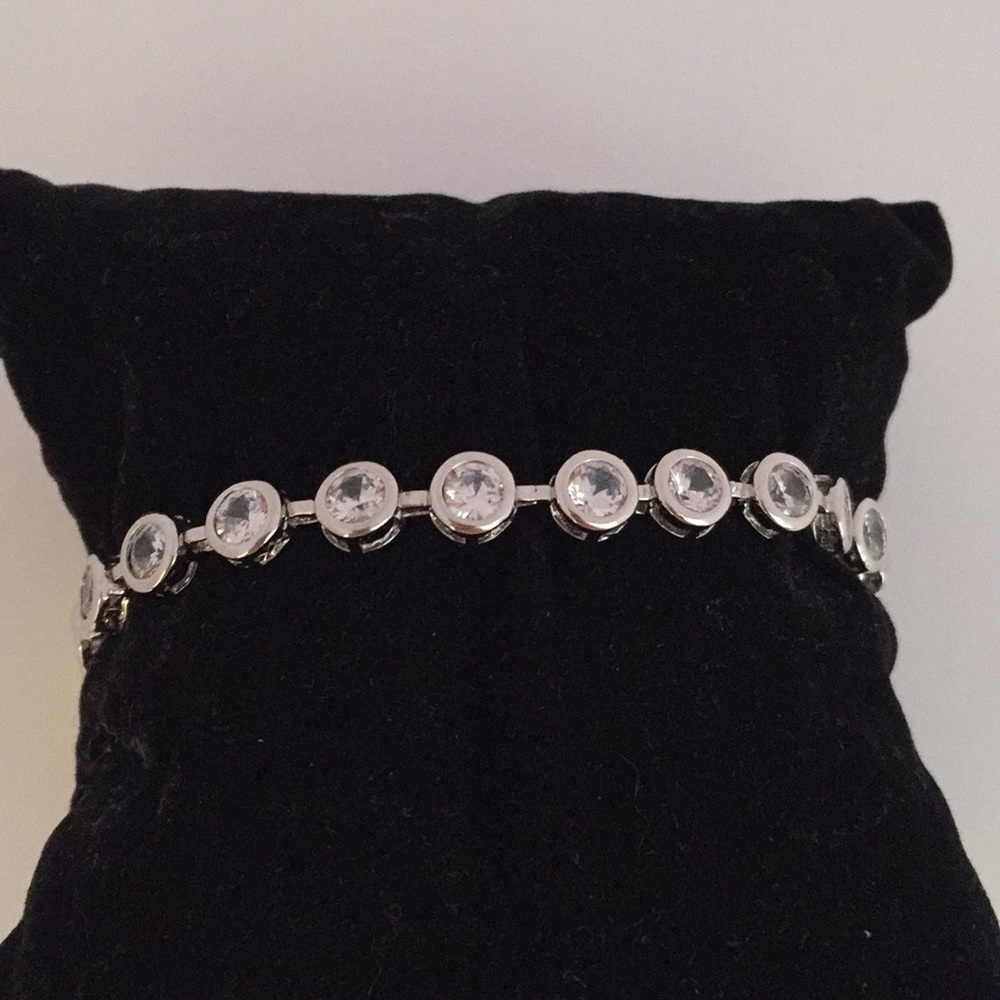 Silver bevel set tennis bracelet